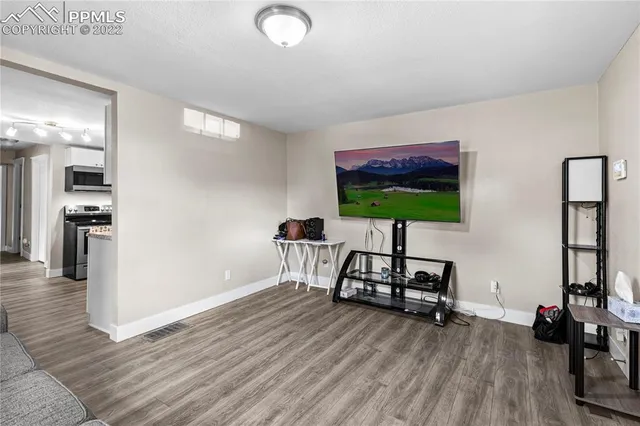 a room with furniture and a wooden floor