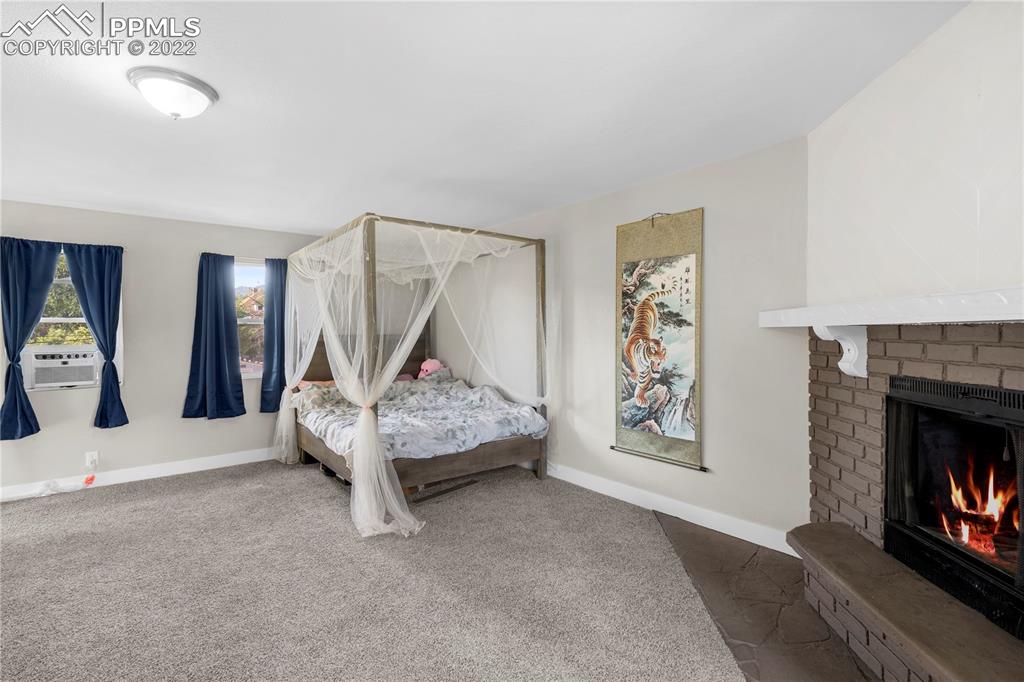 738 Harrison Place Colorado Springs, CO 80905 - Photo 17 of 25 a living room with furniture and a fireplace