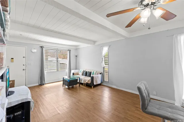 a living room with furniture and a window