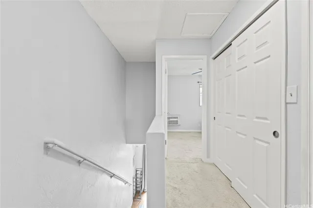 a view of a hallway with closet