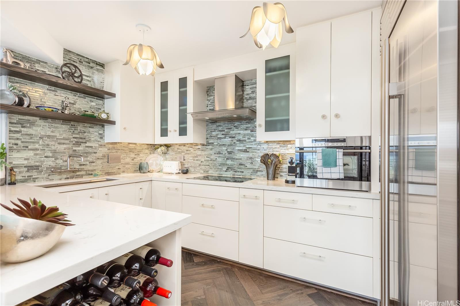 a kitchen with granite countertop white cabinets and white appliances