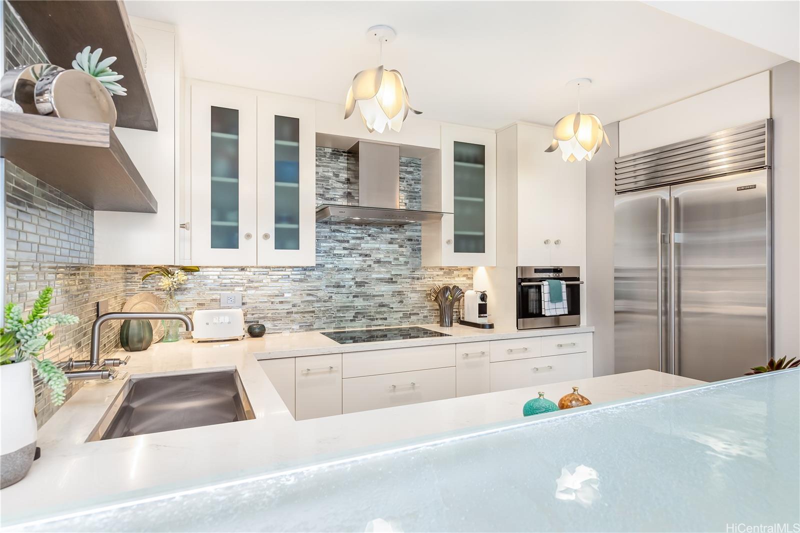 1212 Nuuanu Avenue, Unit 3411 Honolulu, HI 96817 - Photo 8 of 24 a kitchen with a sink and a refrigerator