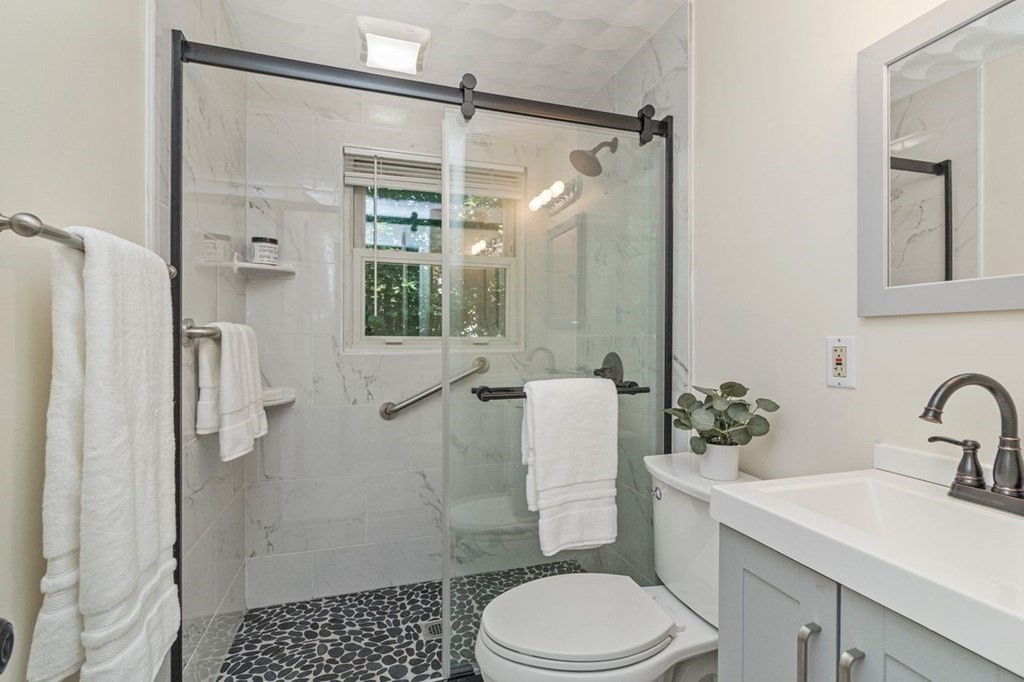 61 Truman Road Newton, MA 02459 - Photo 8 of 28 a bathroom with a sink toilet and shower