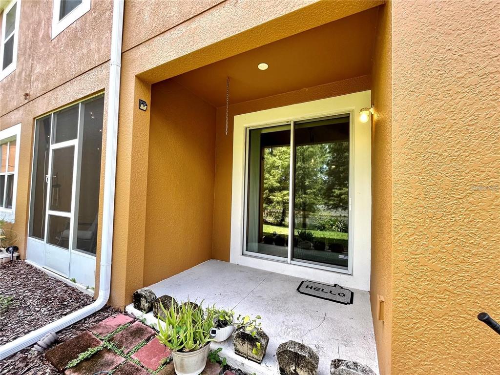 5552 Rutherford Place Oviedo, FL 32765 - Photo 18 of 20 a front view of a house with a yard