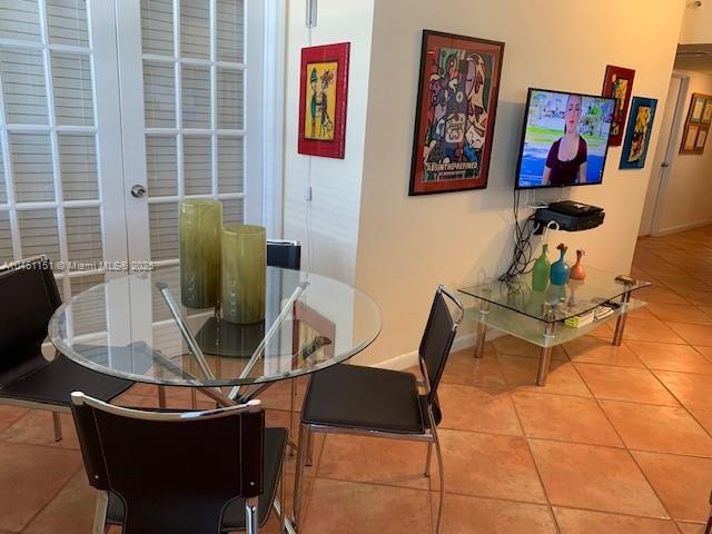 100 Lincoln Road, Unit 1129 Miami Beach, FL 33139 - Photo 3 of 31 a view of a dining room with furniture and a window