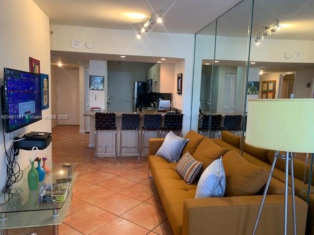 100 Lincoln Road, Unit 1129 Miami Beach, FL 33139 - Photo 4 of 31 a living room with furniture a refrigerator and kitchen view