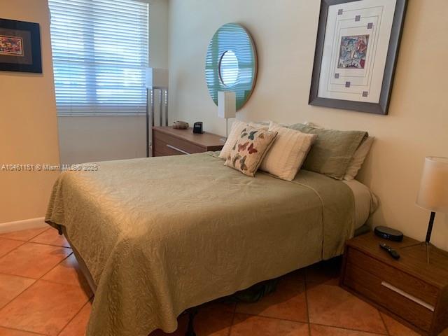 100 Lincoln Road, Unit 1129 Miami Beach, FL 33139 - Photo 8 of 31 a bed sitting in a bedroom next to a window