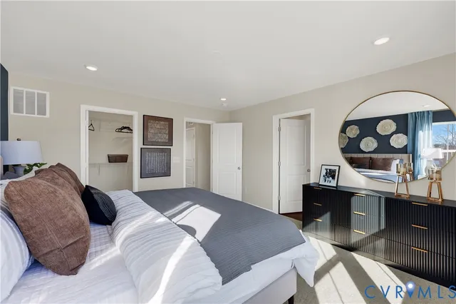 a bedroom with a bed and a table