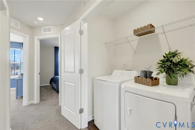 a view of storage and utility room with washer and dryer
