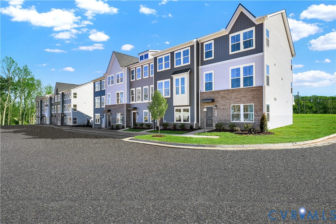 6033 Blue Iris Road Richmond, VA 23225 - Photo 27 of 27 a city view with tall buildings and a yard