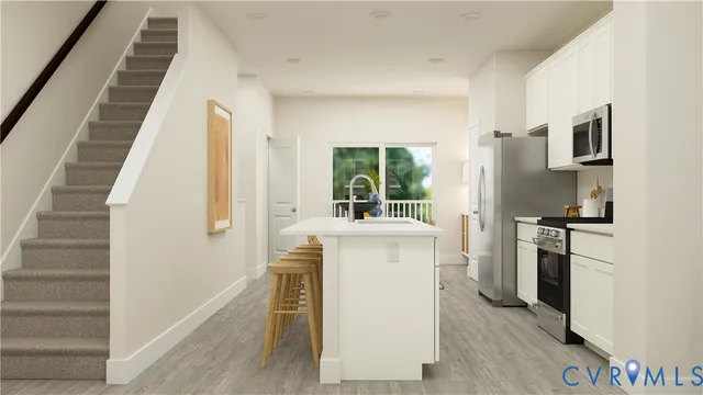 a kitchen with a refrigerator and a stove