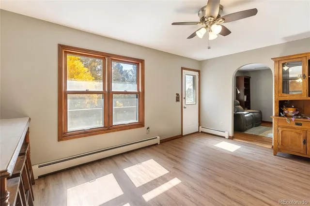 a view of a dining room with furniture window and wooden floor