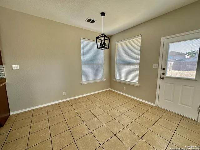a view of an empty room and window