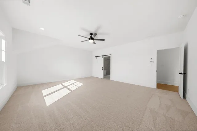 a spacious bathroom with double sink and shower