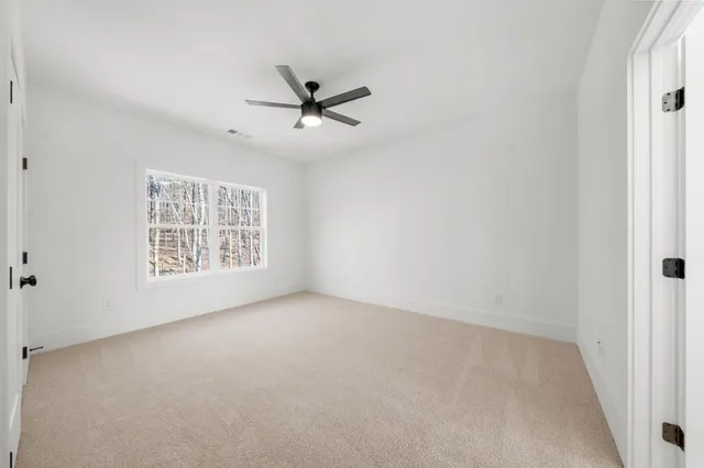 an empty room with a empty space and windows