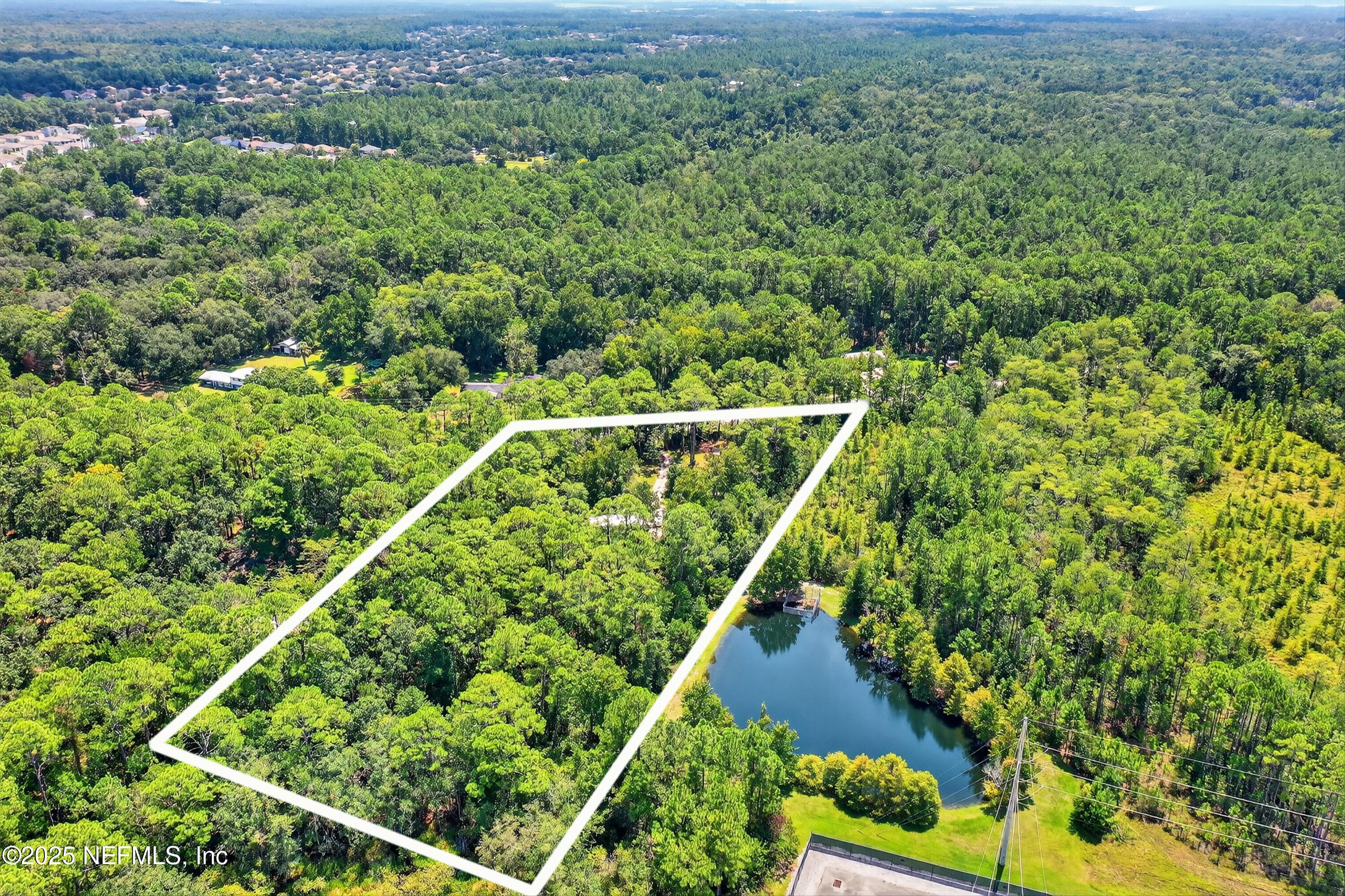 2561 Starratt Road Jacksonville, FL 32218 - Photo 8 of 20 an aerial view of residential houses with outdoor space and trees