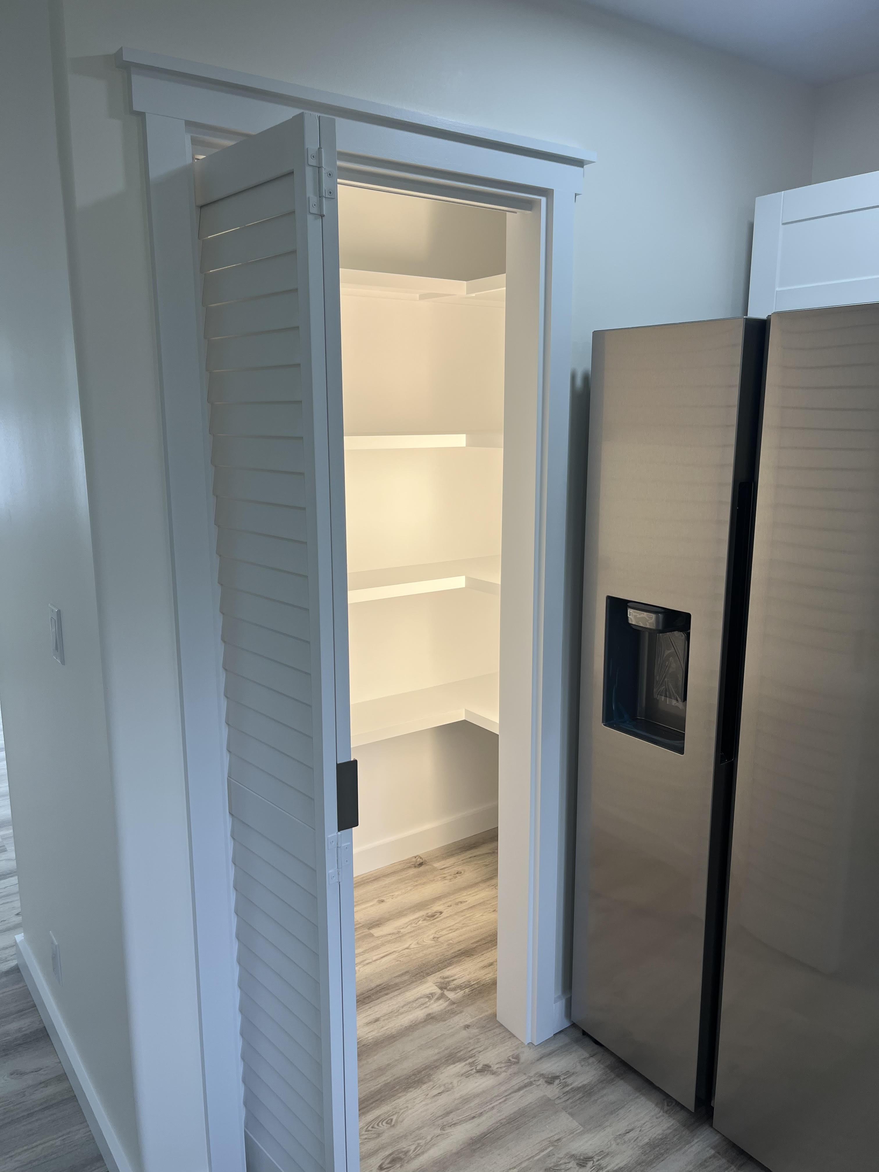 11-3234 Volcano Road Volcano, HI 96785 - Photo 14 of 23 a view of a closet in a room with a door and wooden floor