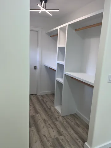 a view of an empty walk in closet