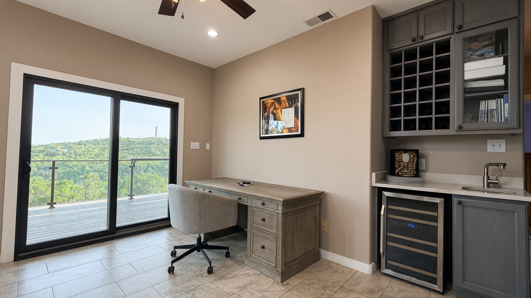 19005 White Rim Trail Jonestown, TX 78645 - Photo 14 of 39 Sliding glass doors open to a scenic deck alongside a custom wet bar.