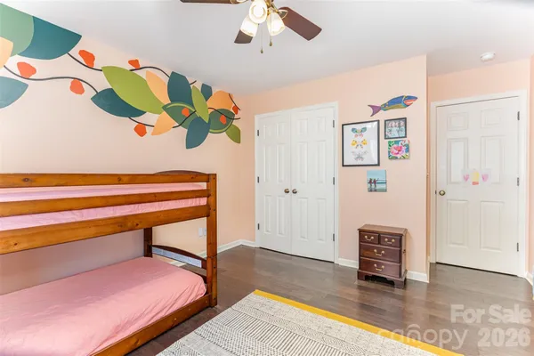 a bedroom with a bed and a couch