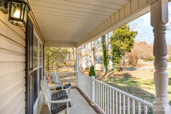 a view of a porch with wooden floor and outdoor space