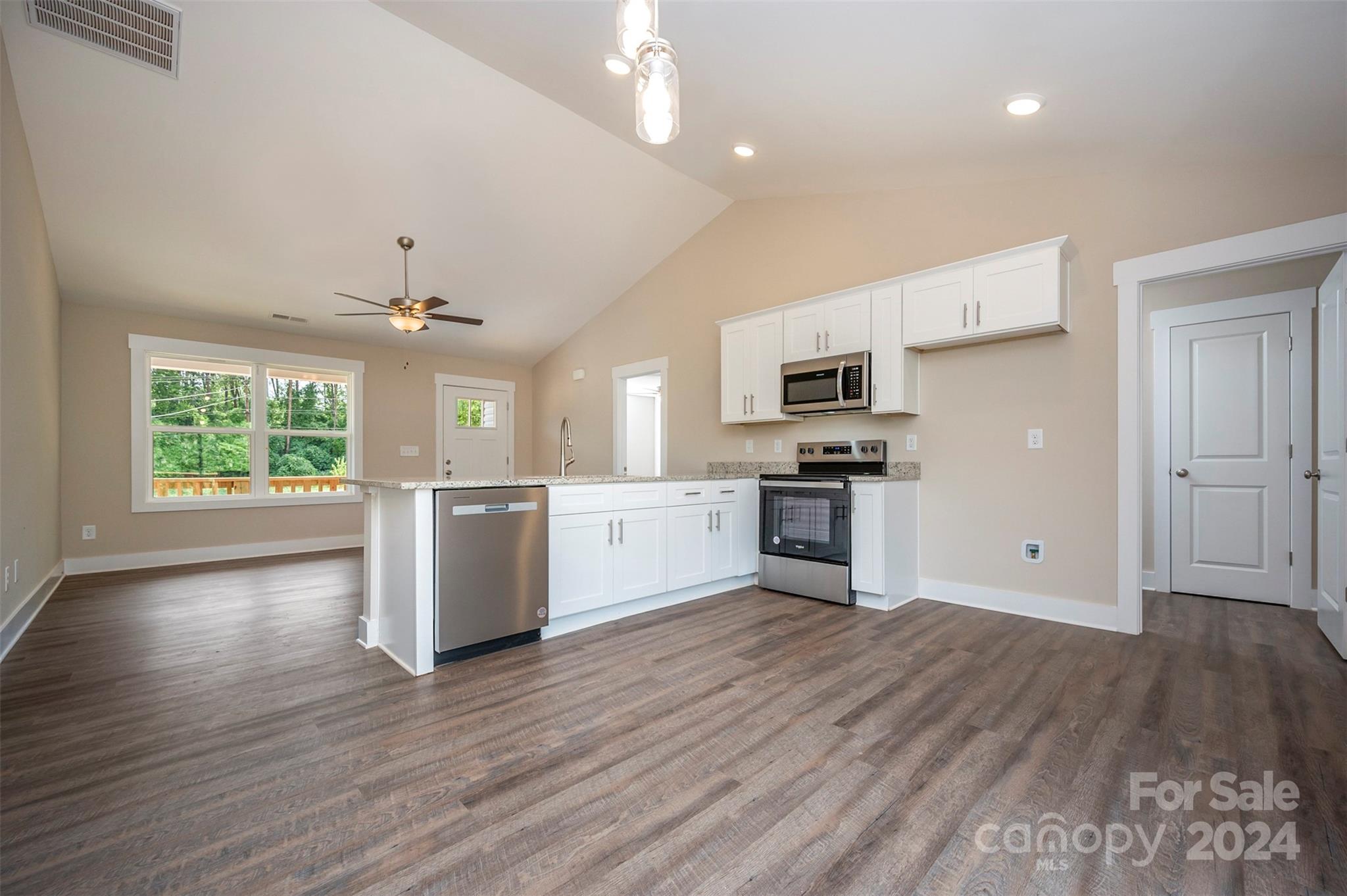 139 Forest Lake Road Forest City, NC 28043 - Photo 13 of 33 a large kitchen with a large counter top stainless steel appliances and cabinets
