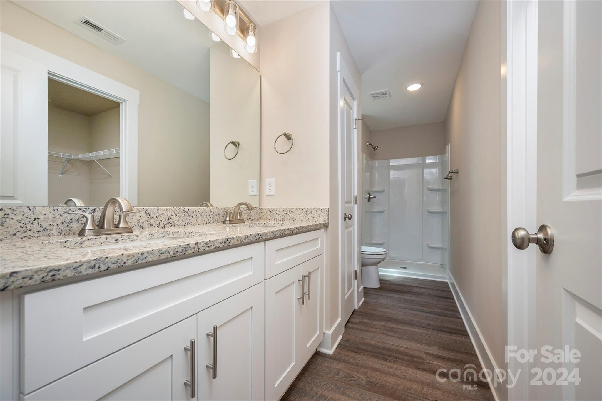 139 Forest Lake Road Forest City, NC 28043 - Photo 18 of 33 a bathroom with a granite countertop sink mirror and a toilet