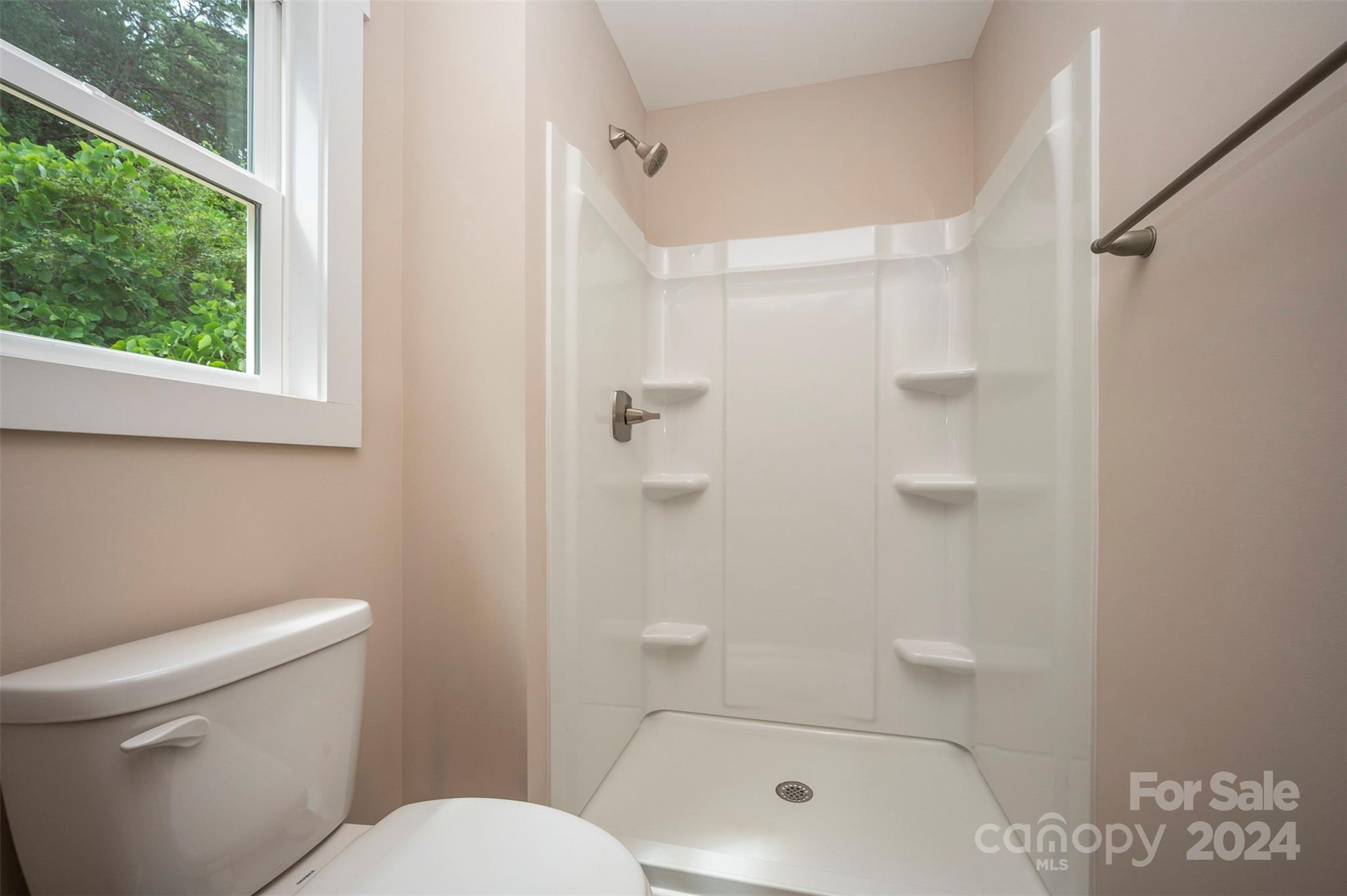 139 Forest Lake Road Forest City, NC 28043 - Photo 19 of 33 a bathroom with a toilet and shower