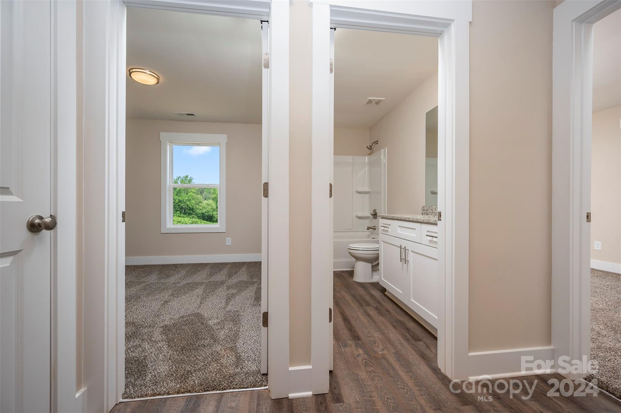 139 Forest Lake Road Forest City, NC 28043 - Photo 21 of 33 a bathroom with a granite countertop sink mirror and toilet