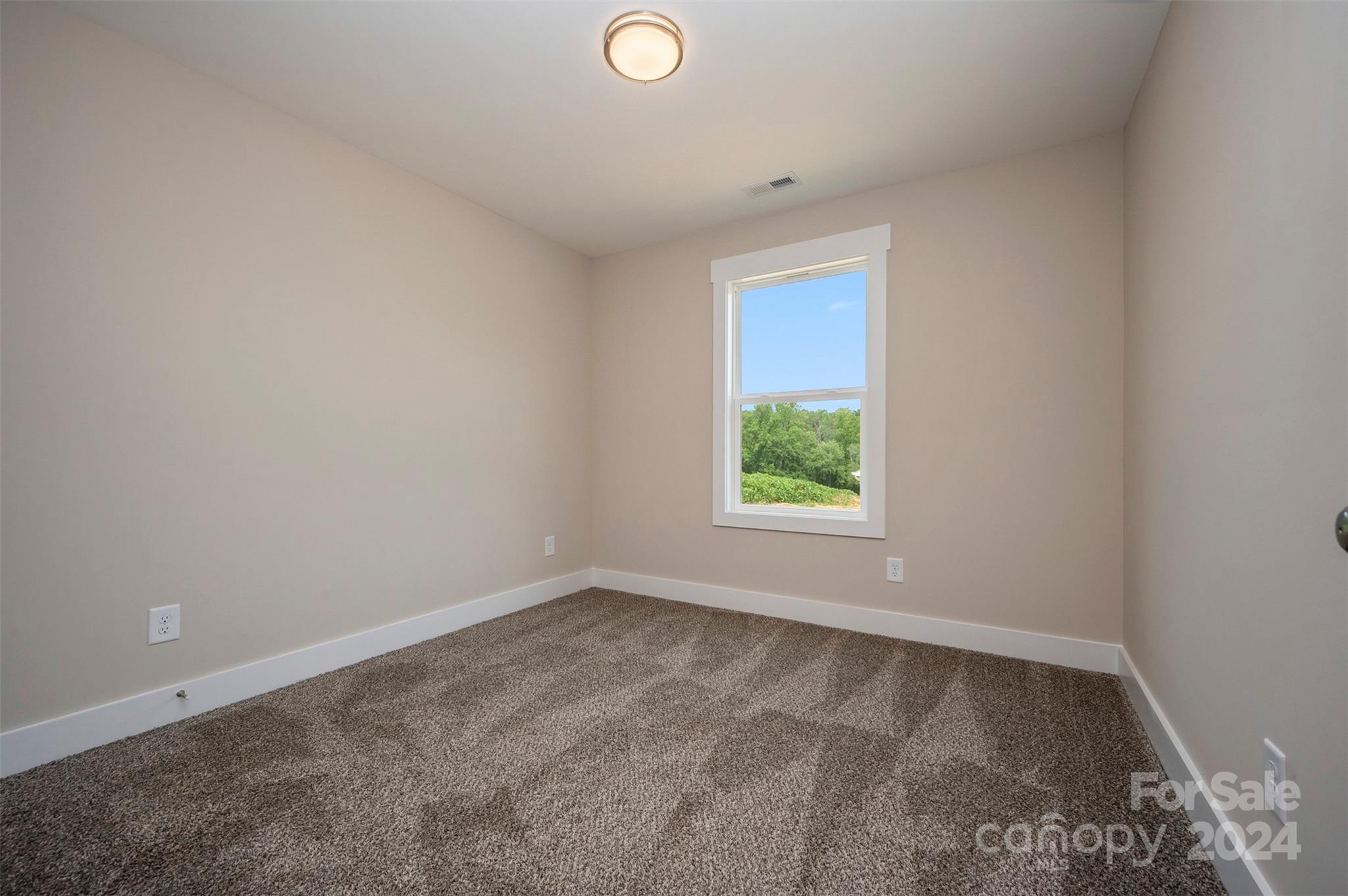 139 Forest Lake Road Forest City, NC 28043 - Photo 22 of 33 an empty room with a window