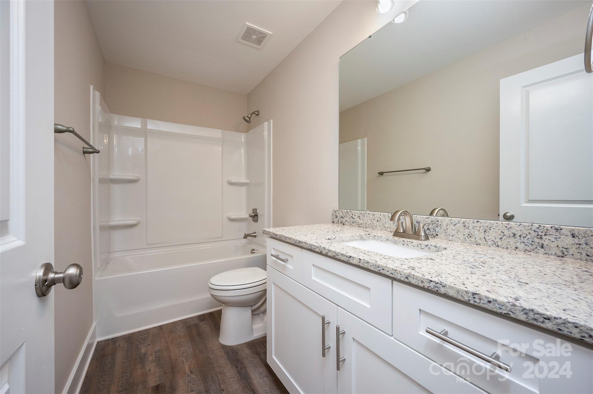 139 Forest Lake Road Forest City, NC 28043 - Photo 24 of 33 a bathroom with a granite countertop sink toilet and shower