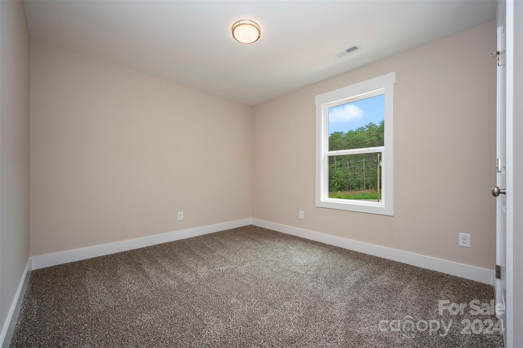 139 Forest Lake Road Forest City, NC 28043 - Photo 25 of 33 an empty room with windows