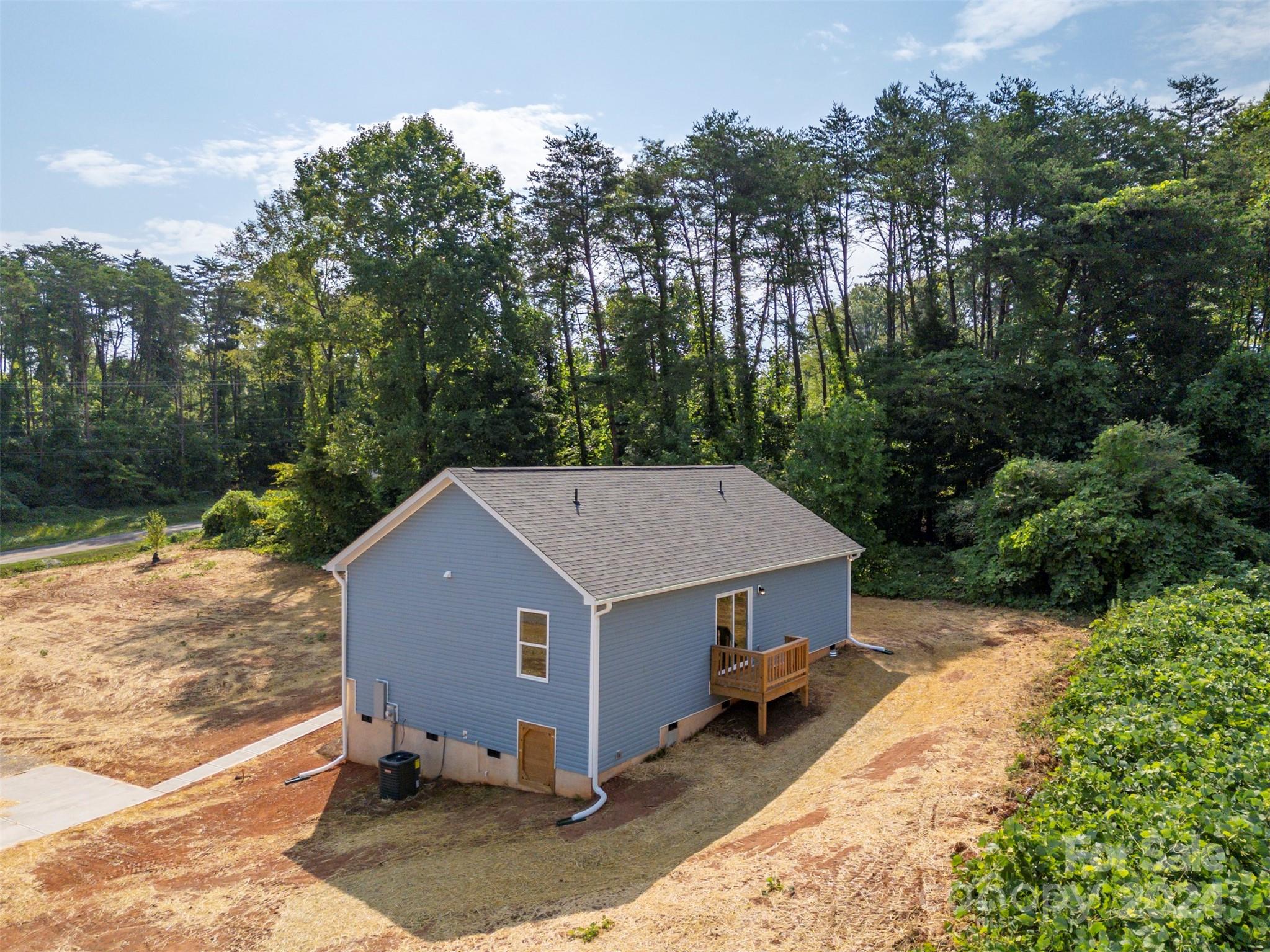 139 Forest Lake Road Forest City, NC 28043 - Photo 27 of 33 an aerial view of a house with yard and trees in the background