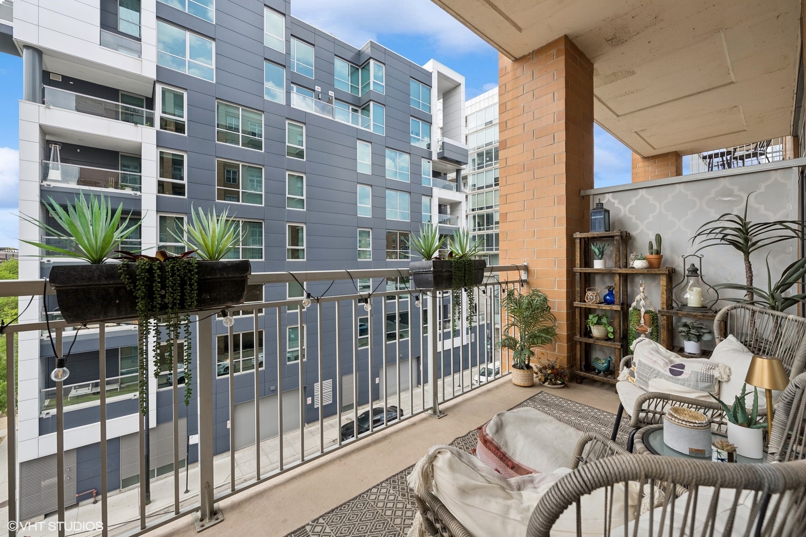 950 West Monroe Street, Unit 410 Chicago, IL 60607 - Photo 15 of 23 a view of balcony with two chairs and a potted plant