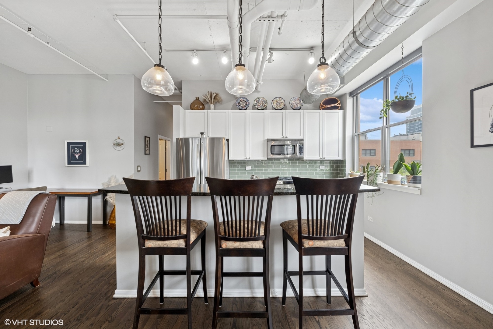 950 West Monroe Street, Unit 410 Chicago, IL 60607 - Photo 5 of 23 a view of a dining room with furniture window and wooden floor