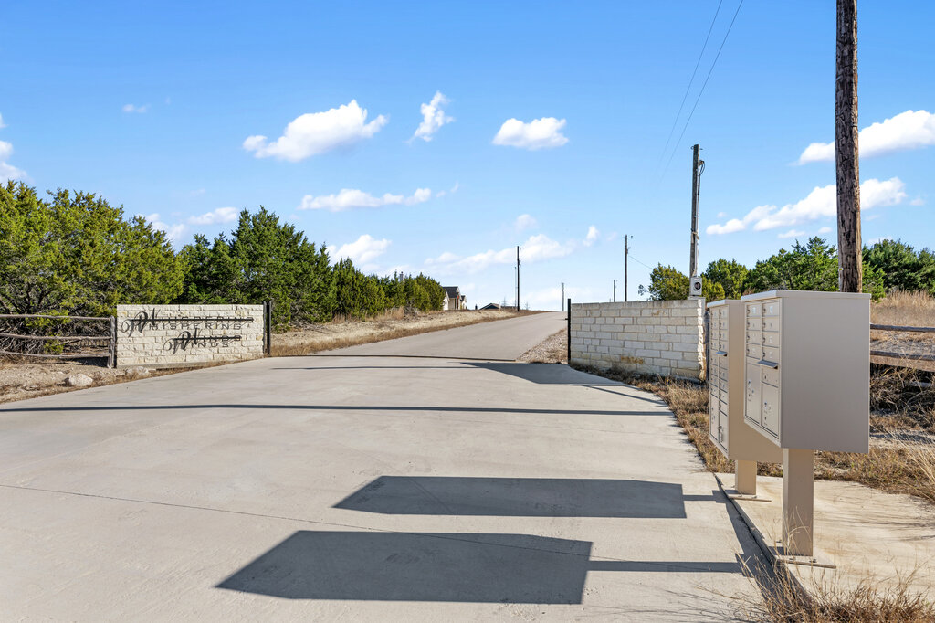 202 Whispering Wind Road Bertram, TX 78605 - Photo 11 of 11 a view of a street with houses