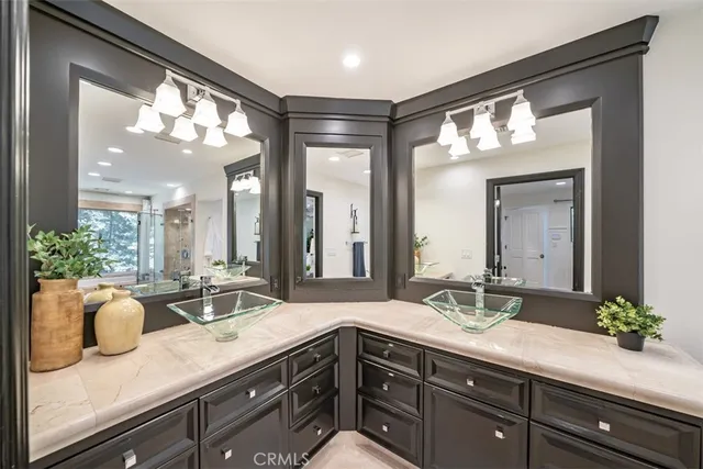 a bedroom with a bed and a mirror