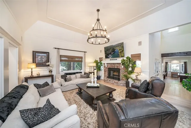 a view of a dining room with furniture wooden floor and chandelier