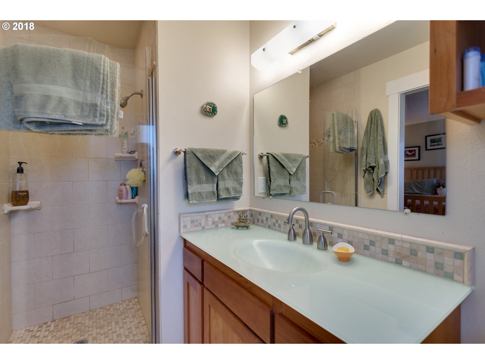 17067 South McCubbin Road Oregon City, OR 97045 - Photo 12 of 32 a bathroom with a sink and a mirror