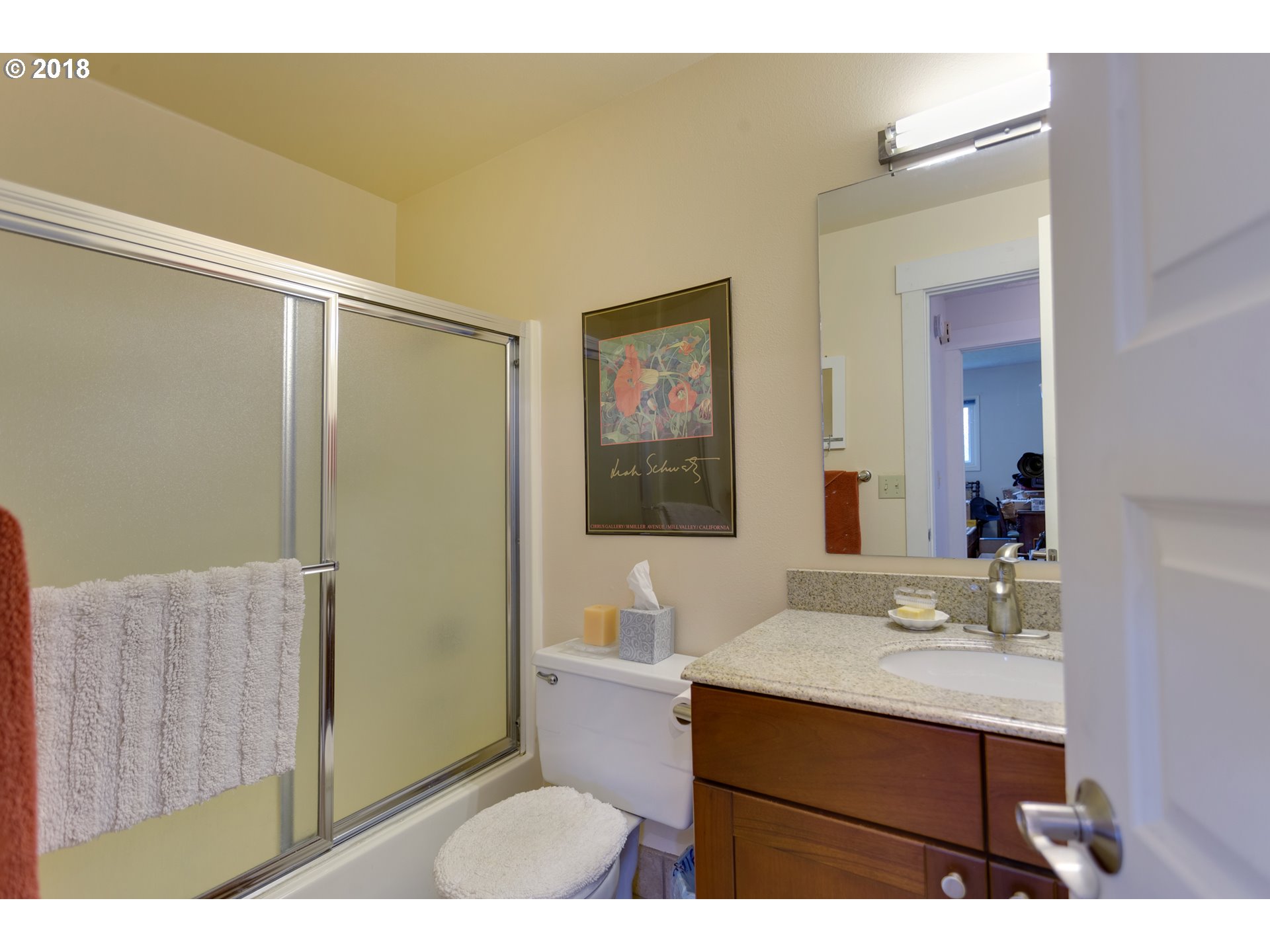 17067 South McCubbin Road Oregon City, OR 97045 - Photo 14 of 32 a bathroom with a sink a mirror and a shower