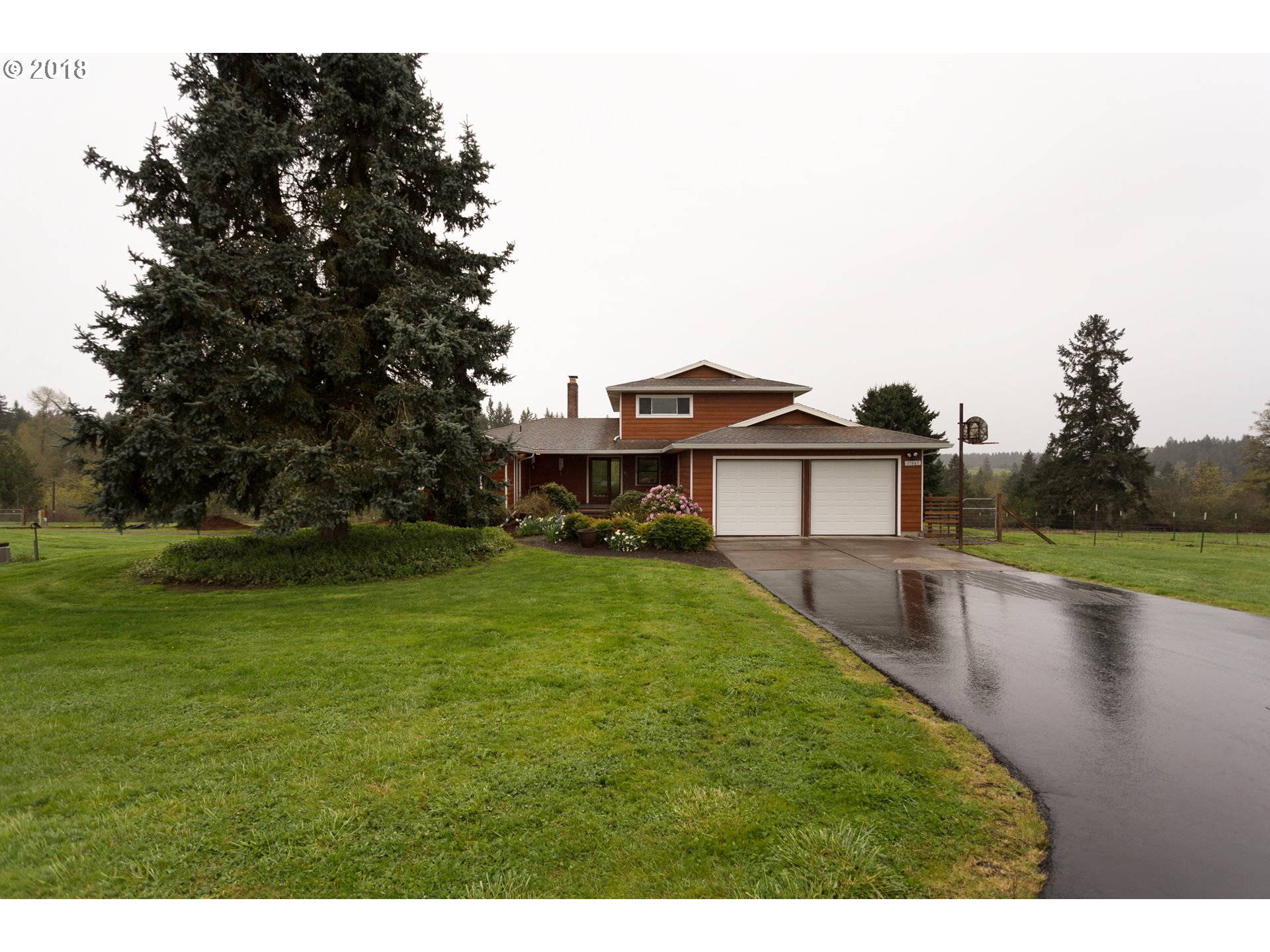 17067 South McCubbin Road Oregon City, OR 97045 - Photo 2 of 32 a view of a house with a yard