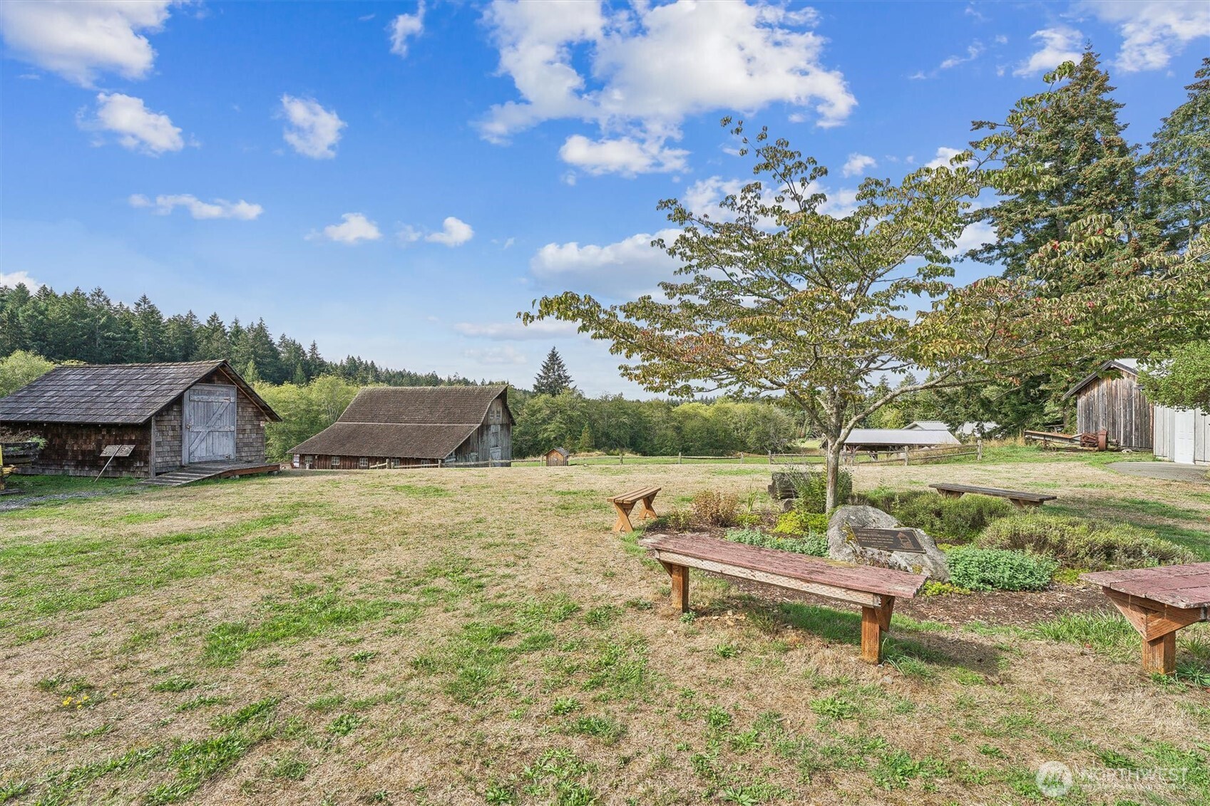 9606 Otso Point Road Anderson Island, WA 98303 - Photo 16 of 25 a backyard of a house with table and chairs