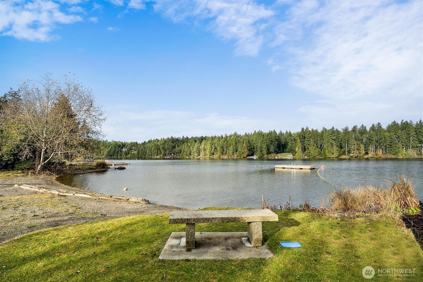 9606 Otso Point Road Anderson Island, WA 98303 - Photo 19 of 25 a view of a lake with houses in the back