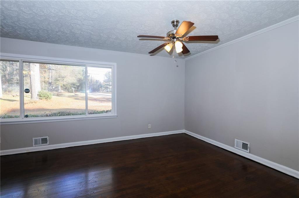 4572 Campbellton Road Southwest Atlanta, GA 30331 - Photo 7 of 21 wooden floor in an empty room with a window