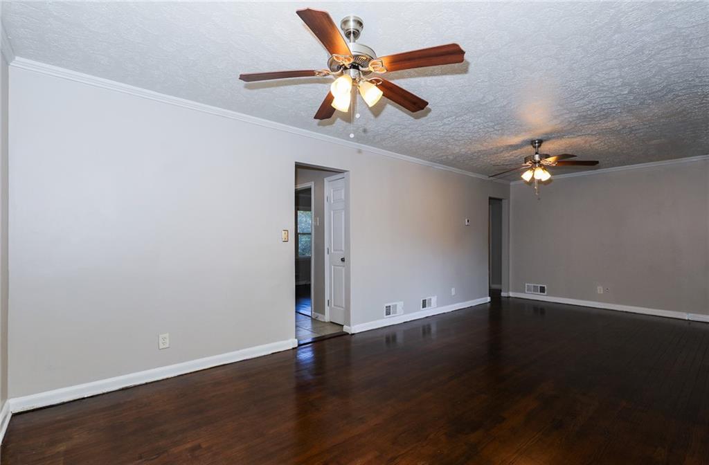 4572 Campbellton Road Southwest Atlanta, GA 30331 - Photo 8 of 21 a view of an empty room with wooden floor