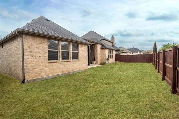 a aerial view of a house with a yard