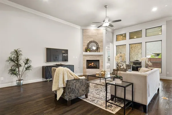 a living room with furniture fireplace and flat screen tv