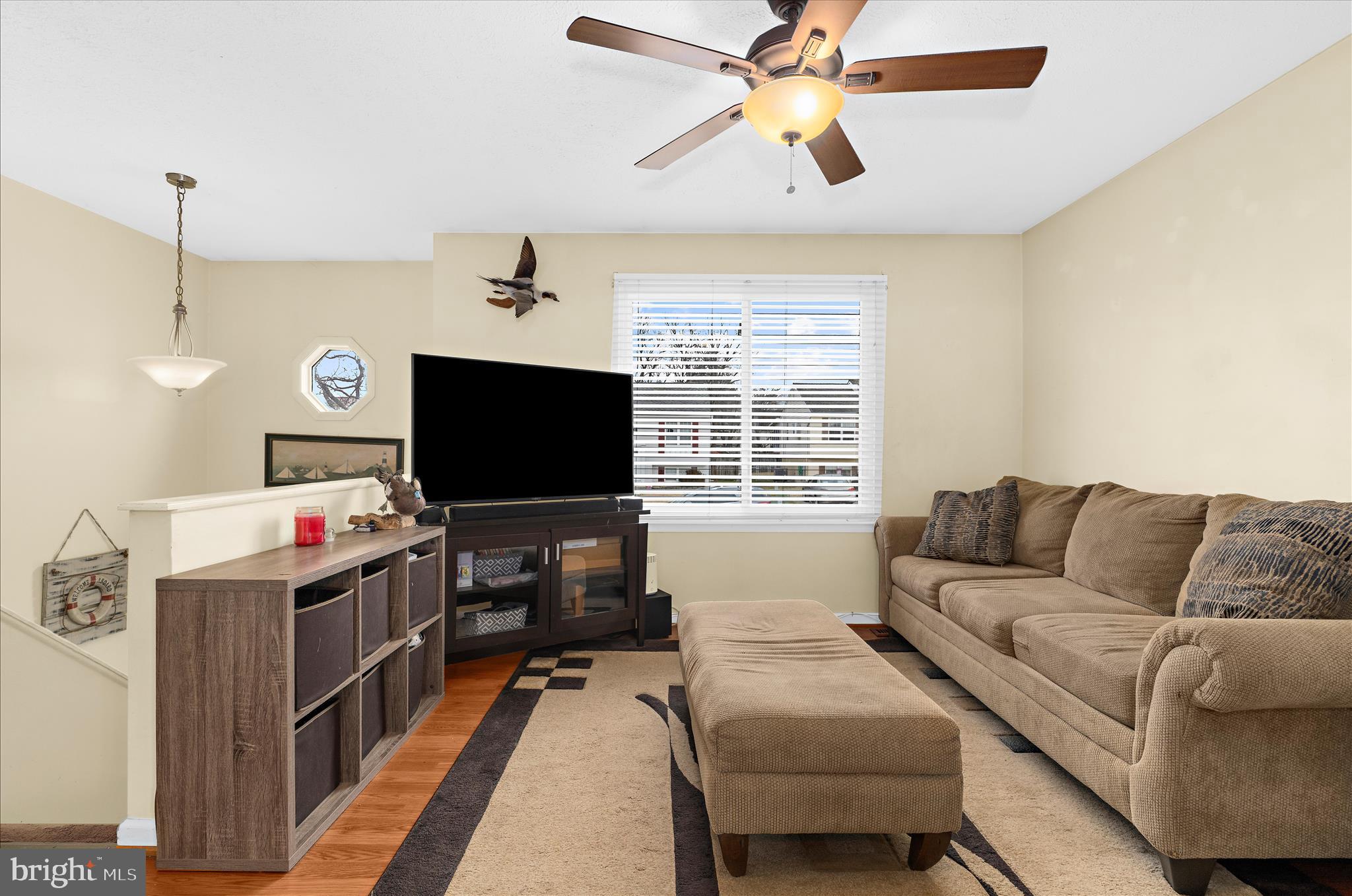2313 230th Street Pasadena, MD 21122 - Photo 6 of 35 a living room with furniture and a flat screen tv