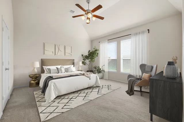 a view of a room with a window and a ceiling fan