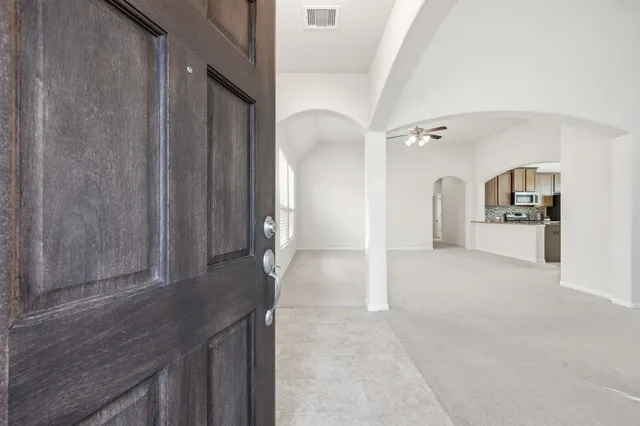 an empty room that has a window in it